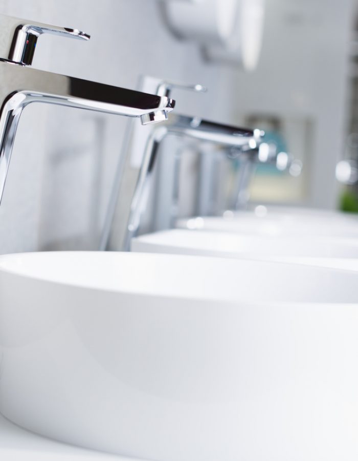 Picture of ceramic wash basin with chrome tap in bathroom fitment store
